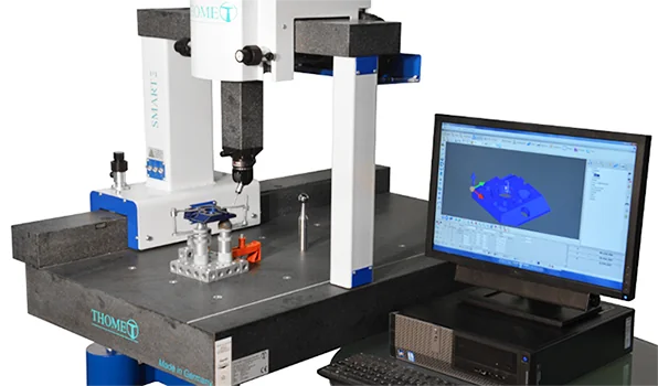 Coordinate measuring machine probing a machined component